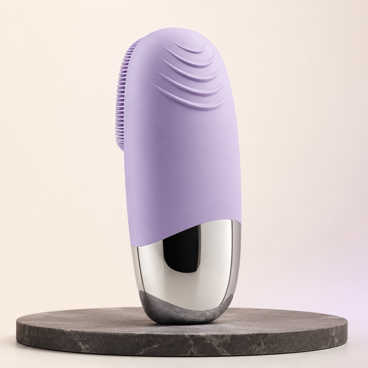 Muted lavender silicone facial cleansing brush with metallic base