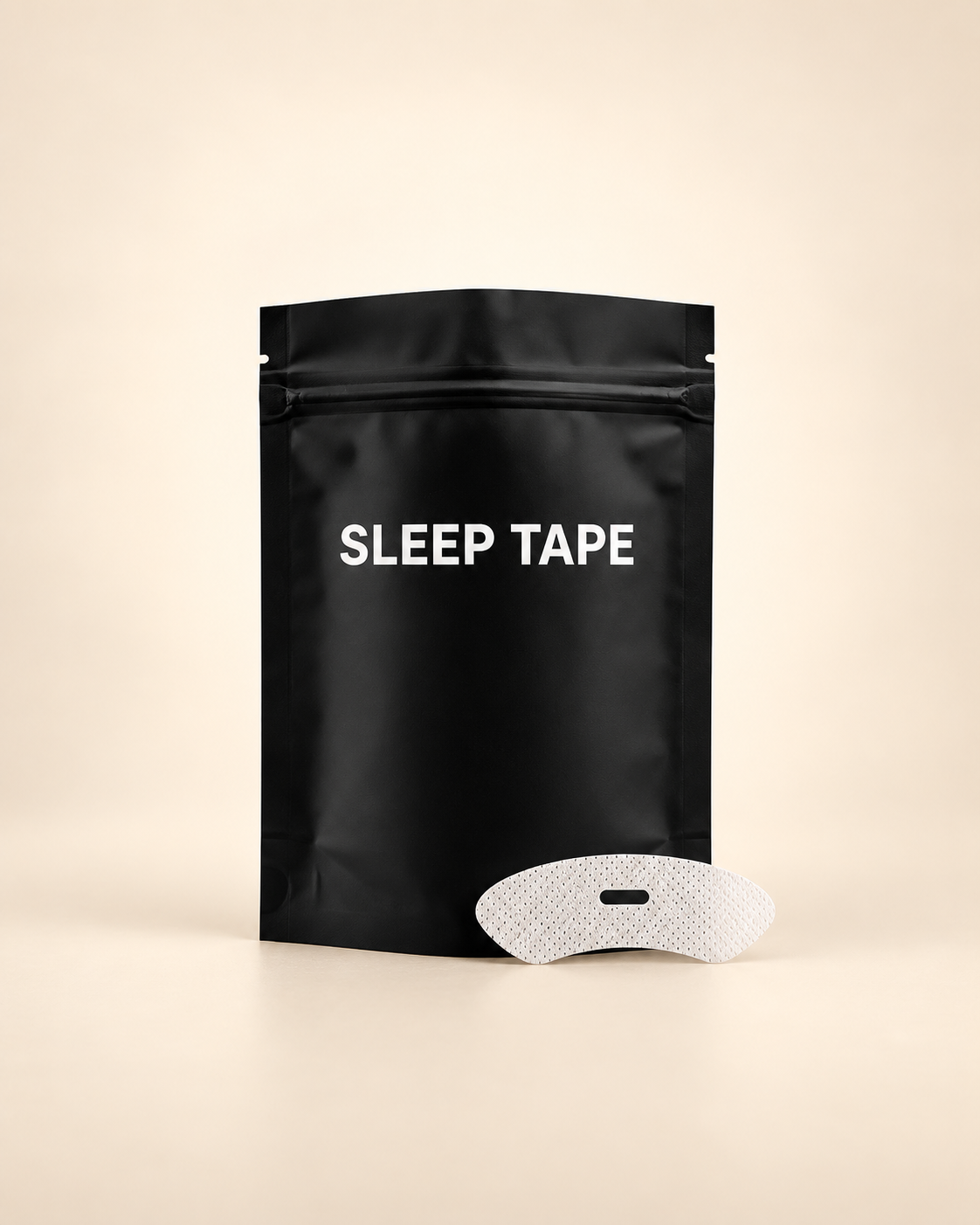 Sleep Tape pouch with one breathable strip on a warm ivory studio background